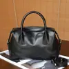Bolso de mano de cuero genuino, bolso tipo bowling de nicho para mujer, bolso Boston tipo almohada moderno y versátil, bolso cruzado de diseño casual