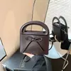 Bolsa de mão simples com laço transfronteiriça para mulheres, nova bolsa elegante e versátil de alta qualidade para ombro e transversal 2026