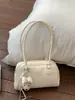 Item Quente com Relevo de Cruz Bolsa de Axila Feminina 2026 Nova Nicho Alta Aparência Bolsa de Ombro Único Versátil Toque de Luxo Bowling