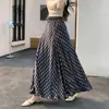 Moderna falda de cuadros retro para mujer, nuevo estilo primavera-verano 2026, falda larga irregular tipo paraguas que cubre las caderas y tiene un efecto adelgazante