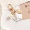 Ins Coreano Elegante Concha de Perla Moneda Retro Reina Moneda de Oro Bolso Colgante Cubierta Protectora para AirPods Llavero