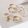 Anillo abierto de diseño de nicho de alta gama, lujo ligero en forma de corazón, conjunto de cinco piezas de anillo de moda personalizado europeo y americano con incrustaciones de diamantes