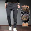Pantalones casuales nuevos para primavera y otoño 2024, overol para hombre, bordado chino de calidad, cintura elástica, pantalones largos para hombre
