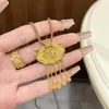 Tienda de oro con collar colgante de disco del emperador palacio de la ley antigua oro de imitación diario todo a juego simple regalar a novia