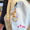 Llavero de personaje de niña de la suerte estilo chino tradicional, cadena para teléfono con cuentas, colgante lindo para bolso, adorno para coche, regalo de moda