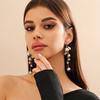 Joyería transfronteriza europea y americana diseño de moda aretes de borla de perla de imitación temperamento dulce y cool aretes de metal con cuentas para mujer