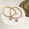 Pulsera de Acero de Titanio con Cuentas de Nicho de Dibujos Animados Oso Microincrustado Concha Pulsera Elástica Lindo Oso de Nácar Pulsera de Amor