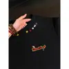 Verano 2026 Nuevo Estilo Pareja a Juego Unisex Diseño Personalizado Cuello Bordado Marca de Moda Camiseta Oversize Holgada