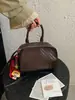 Bolsa pequena estruturada com padrão trançado para mulheres, nova bolsa quadrada pequena casual 2026, bolsa transversal de mão para o verão de alta qualidade para o trabalho