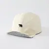 Sombrero de color sólido versátil para bebé con ala suave al por mayor nuevo sombrero solar transpirable para niño pequeño gorra de béisbol linda de cachorro para bebé