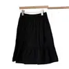 Falda midi caqui estilo universitario 2026 nuevo diseño de primavera falda midi de bolsillo estilo japonés que reduce la edad falda de línea A versión coreana