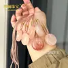 Colgante de Paz Flor de Durazno de Seda Dorada de Xinjiang, Adorno Colgante de Paz Ágata Ojo de Gato Verde de Tianshan, Fuente de Suministro para Transmisiones en Vivo
