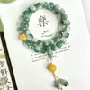 Pulsera de Raíz de Bodhi Estilo Paisaje con Cuentas Verdes Estilo Antiguo y Patrones Florales, una Pulsera de Cuentas Budistas para Sostener en la Mano para Mujeres en Estilo Chino Tradicional