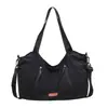 Nova Bolsa de Lona Outono 2026 Estilo Coreano Retrô Cor Sólida Grande Capacidade Bolsa Tote para Trabalho Deslocamento Bolsa de Ombro Casual