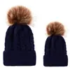 Comercio exterior europeo y americano en otoño e invierno gorro tejido de punto de bola retorcida cálido para mujer padre-hijo imitación bola de pelo de mapache gorro de lana
