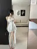Vestido camisola de encaje de deseo puro estilo francés para mujer, nuevo modelo 2026, blanco, con dobladillo irregular, entallado a la cintura, vestido largo adelgazante