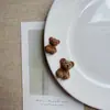 Nuevo accesorio de oso marrón de peluche de dibujos animados lindo DIY pegamento de crema pinza para el pelo de niña llavero para zapatos y bolsos Crocs