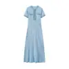 Ropa de Mujer Europea y Americana Primavera y Verano 2025 Celebridad Elegante Elástico Adelgazante Aspecto Cuello Redondo Botón Vestido Largo de Punto