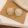 Pendientes de Botón Ovalados de Resina Transfronterizos Europeos y Americanos Pendientes Maillard de Otoño e Invierno Pendientes Simples de Moda Versátiles para Mujer Sensación de Alta Gama