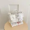 Bolso de cubo tejido de nicho transfronterizo 2026 nuevo bolso de cesta de moda para mujer bolso de mano simple para hombro cruzado