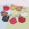 Venta Caliente Bolso de Cosméticos de Piel Sintética para Pelo de Mascota Llavero Portátil con Huella de Pata Colgante Etiqueta Conmemorativa para el Pelo Etiqueta para Mascota Gato y Perro