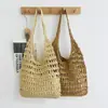 Bolso de paja tejida hecho a mano con diseño calado de gran capacidad para mujer, nuevo bolso de paja de estilo francés simple para vacaciones en la playa y uso en la playa