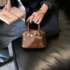 Bolsos de Moda Europeos y Americanos Transfronterizos para Mujer, Bolsos de Mano Brillantes de Nicho, Mini Bolsos Cruzados Nuevos de Primavera de Charol para Niños