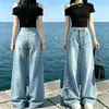 Jeans de perna larga da moda com alças de gravata borboleta e barra flare, projetado para ser emagrecedor e estiloso, apresentando um corte reto único e solto.