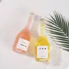 Venta Directa a Precio de Fábrica Botellas de Vidrio de Gama Alta Botellas de Vino de Rayas Verticales de Alto Valor Botellas de Vino de Frutas de Moda Botellas de Bebidas de Jugo Botellas de Vino Vacías