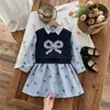 Conjunto de Duas Peças Outono 2026 Novo Estilo Universitário Transfronteiriço Vestido Listrado com Laço e Colete Liso para Meninas