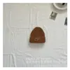 Versão coreana de boné de lã tricotado com logo de rosto sorridente personalidade outono e inverno infantil tendência boné pullover quente meninos e meninas atacado