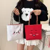 Bolso de Lona Bordado Nuevo Otoño 2026 Bolso Tote Pequeño para Mujer Estilo de Oficina Bolsa Cuadrada Vertical