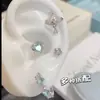 Clavos para Hélice de Oreja de Gota de Agua de Saturno Microincrustados Pendientes de Acero de Titanio Médico Estilo Coreano de Lujo Accesible de Nicho Pendientes para Piercing de Oreja para Mujeres