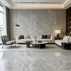 Piso de sala de estar, mármol gris con patrón de nubes, escalones de escalera iluminados, mármol hecho a medida, repisa de ventana gris, umbral de piedra y lavabo de piedra