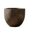 Maceta de GRC con textura mate negra cóncava-convexa y apariencia creativa que llama la atención y es llamativa, utilizada para decoración exterior y plantación en parques culturales y creativos