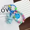 Nuevo Llavero Colgante de Conejo Acrílico Tridimensional Galvanizado Accesorios Pequeños Frescos de Colores con Cuentas Decoración para Cubierta de Auriculares