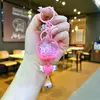 Llavero acrílico con forma de botella de arenas movedizas en aceite, regalo al por mayor, colgante de muñeca de donut, lindo llavero de arenas movedizas.