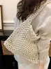 2026 Verano Nuevo Bolso de Hombro de Malla Hueca Estilo Coreano de Moda Bolso de Mano Tejido de Alta Moda para Vacaciones en la Playa