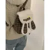 Bolsa de Mão Pequena da Moda Estilo Coreano para Mulheres 2025 Nova Mochila de Lã Xadrez de Inverno Bolsa de Pelúcia Fofa de Coelho de Desenho Animado
