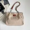 Bolsa feminina 2026 outono nova estilo coreano bolsa escolar estudantil simples moda bolsa de ombro grande capacidade bolsa tote para o dia a dia