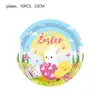 Suministros para fiestas de decoración de Pascua en stock: platos de papel, vasos de papel, huevos de caricatura, bolsas de regalo, manteles, banderas y accesorios de decoración navideña