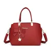 Bolso de mano elegante para el día a día, superventas transfronterizo, con múltiples compartimentos, gran capacidad y un dulce diseño de lazo y concha, adecuado para llevar al hombro o cruzado.