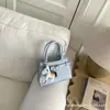Bolso de Hombro Versátil de Nicho para Mujer Verano 2026 Nueva Moda Bolso de Mano de Alta Gama Elegante Bolso Cuadrado Pequeño para Salir