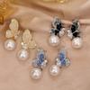 Aretes de Mariposa de Cristal Degradado con Perla Diseño Nicho Lujo Ligero de Alta Gama 2025 Nuevos Aretes Explosivos de Celebridad de Internet para Mujer