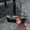 Bolso hobo de axila para mujer 2026 nuevo modelo bolso baguette de alta gama bolso horizontal tipo dumpling bolso de mano versátil para el día a día bolso de hombro