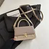 Bolso pequeño cuadrado tejido 2026 nuevo bolso de hombro de moda bolso simple para mujer bolso de mano pequeño bolso de mujer de comercio exterior bolso cruzado