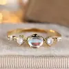 Anillo Fino Rongxing Transfronterizo con Piedra Principal Ovalada, Adornado con Piedras Redondas en Ambos Lados del Anillo, Anillo Cotidiano Suave y Lujoso