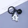 Clip de resorte Campanita Llavero de Gato Dibujo animado lindo Gato Donut Mochila Funda para auriculares Colgante de moda versátil