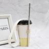 En stock funda para taza de cuero pu corazón de niña estilo ins aislamiento térmico antideslizante cubierta aislante estilo Hong Kong para té con leche manual portátil