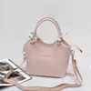 Nuevo bolso tipo cubo de cuero, con una textura suave de cuero PU, versátil bolso cruzado o de hombro, con un asa de cuerda de algodón anudada, un bolso de mano único y elegante para mujer